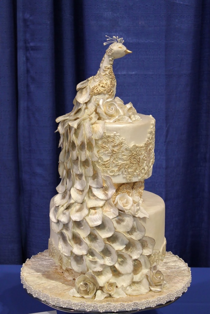 white and gold peacock wedding cake